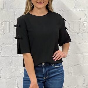 Black blouse with bow detail on sleeves